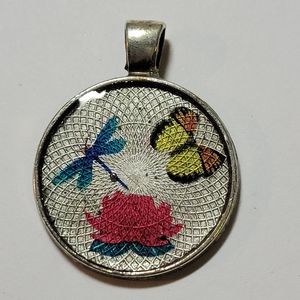 Dragon fly, butterfly and flower pendant.